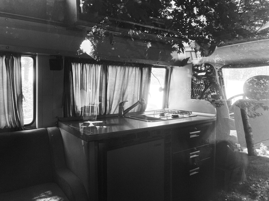 Interior of an outside broadcast van filled with monitors