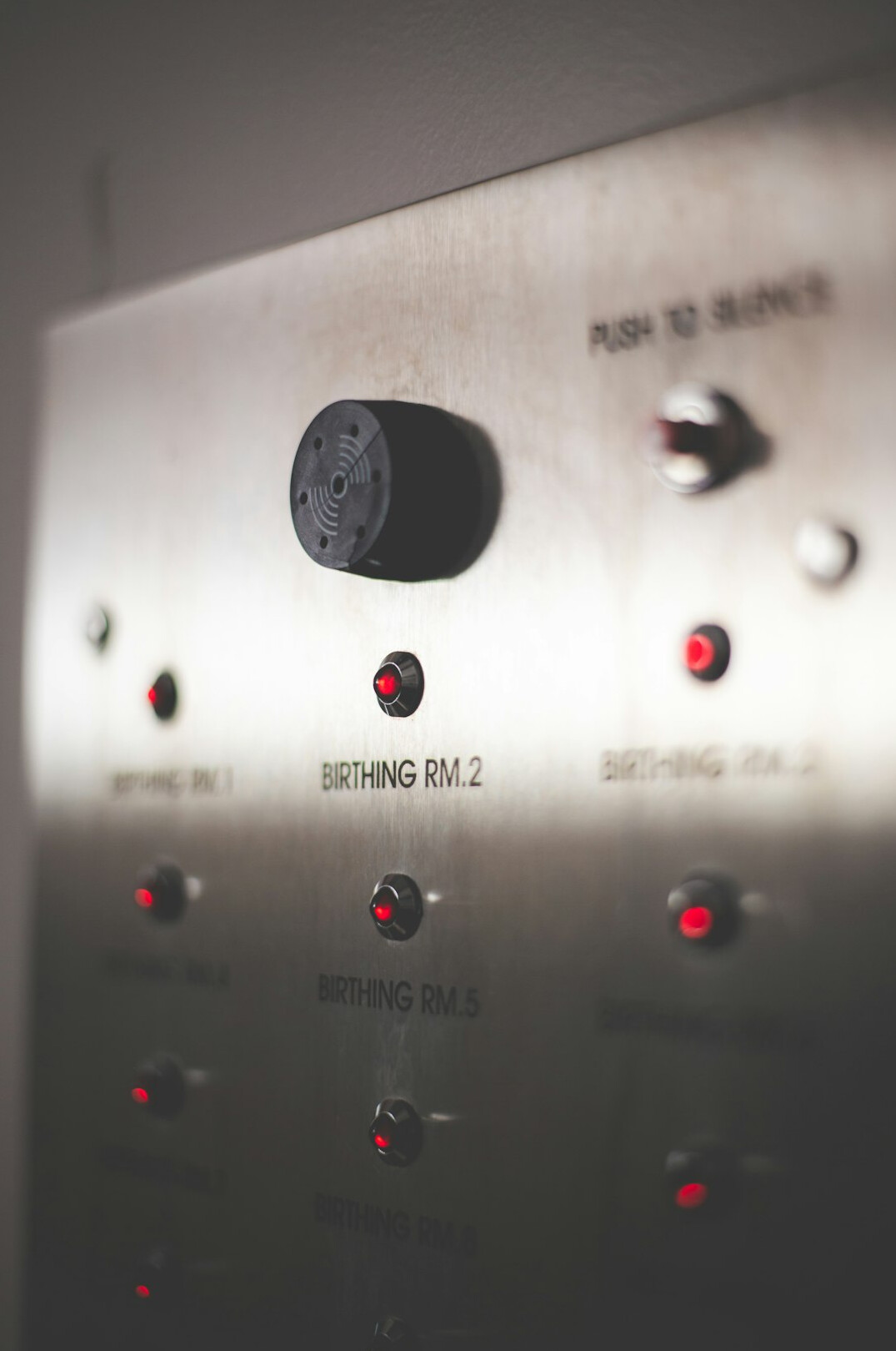 Close-up of a video switcher panel with illuminated buttons